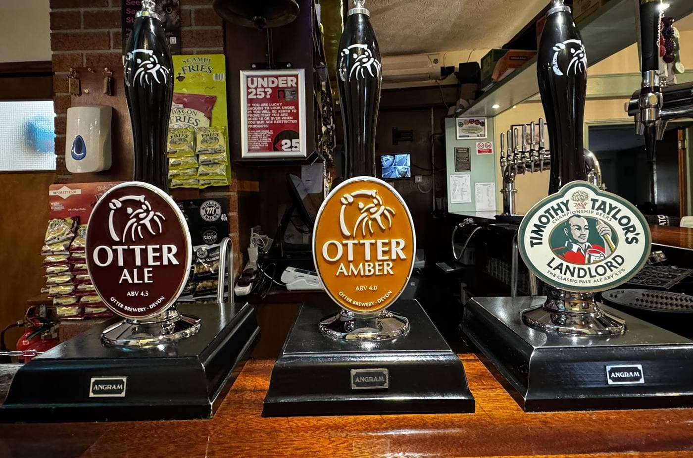 Real ale at the bar -- Otter Ale, Otter Amber and Timothy Taylor's Landlord hand pumps.